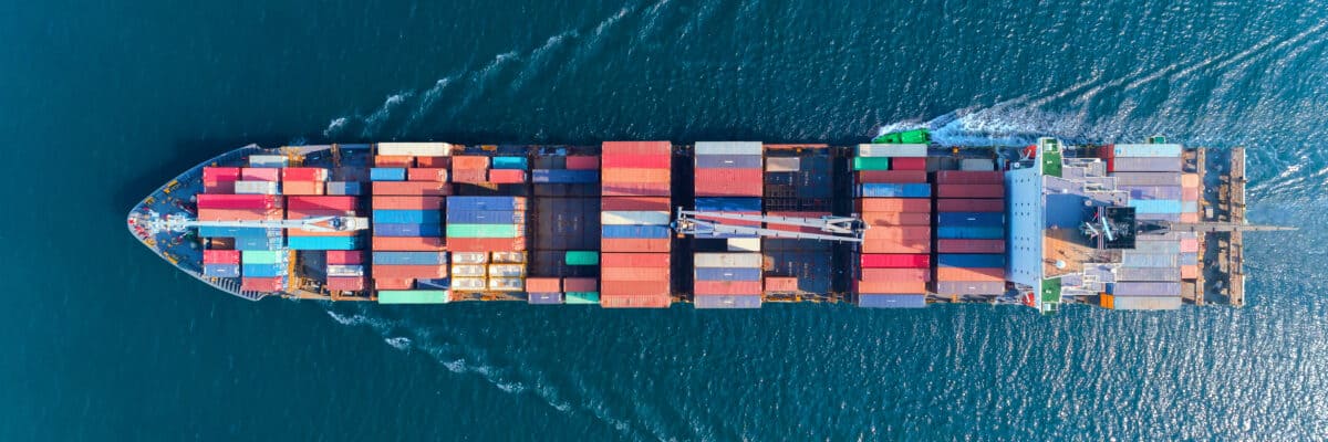Aerial top view container ship with crane bridge for load container, logistics import export, shipping or transportation concept background.