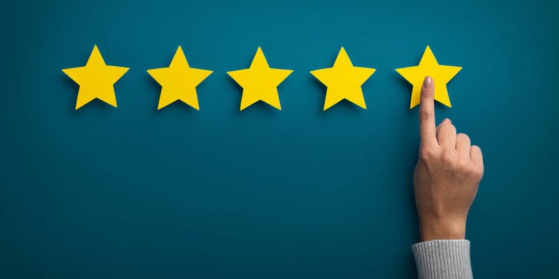 Customer Experience Concept. Woman hand showing on five star excellent rating on background, copy space